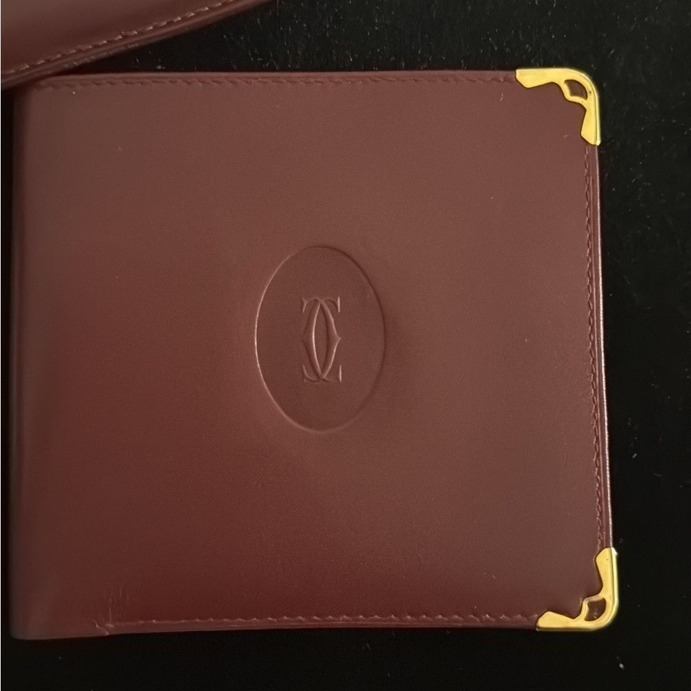 Never used Cartier red burgundy wallet comes with original box